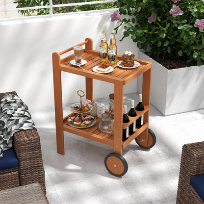 The wooden bar cart displaying desserts and drinks on a sunny patio terrace