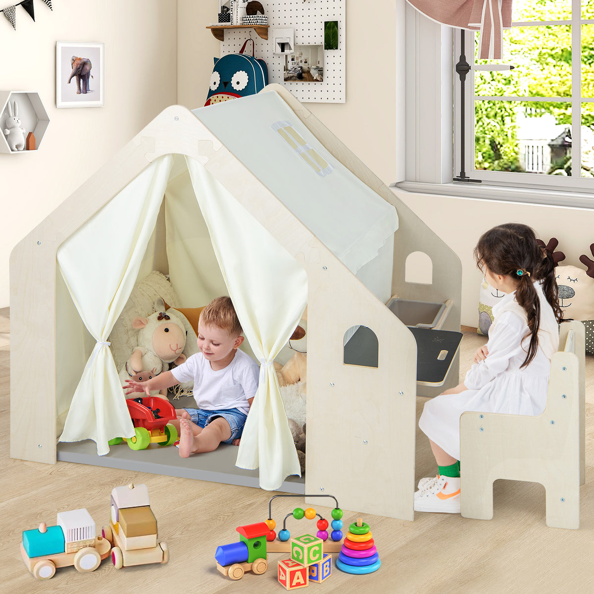 The wooden playhouse with a storage bin and chair surrounded by various toy blocks