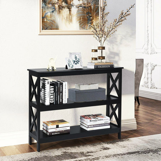 Black three-tier console table styled with books and vases in a hallway