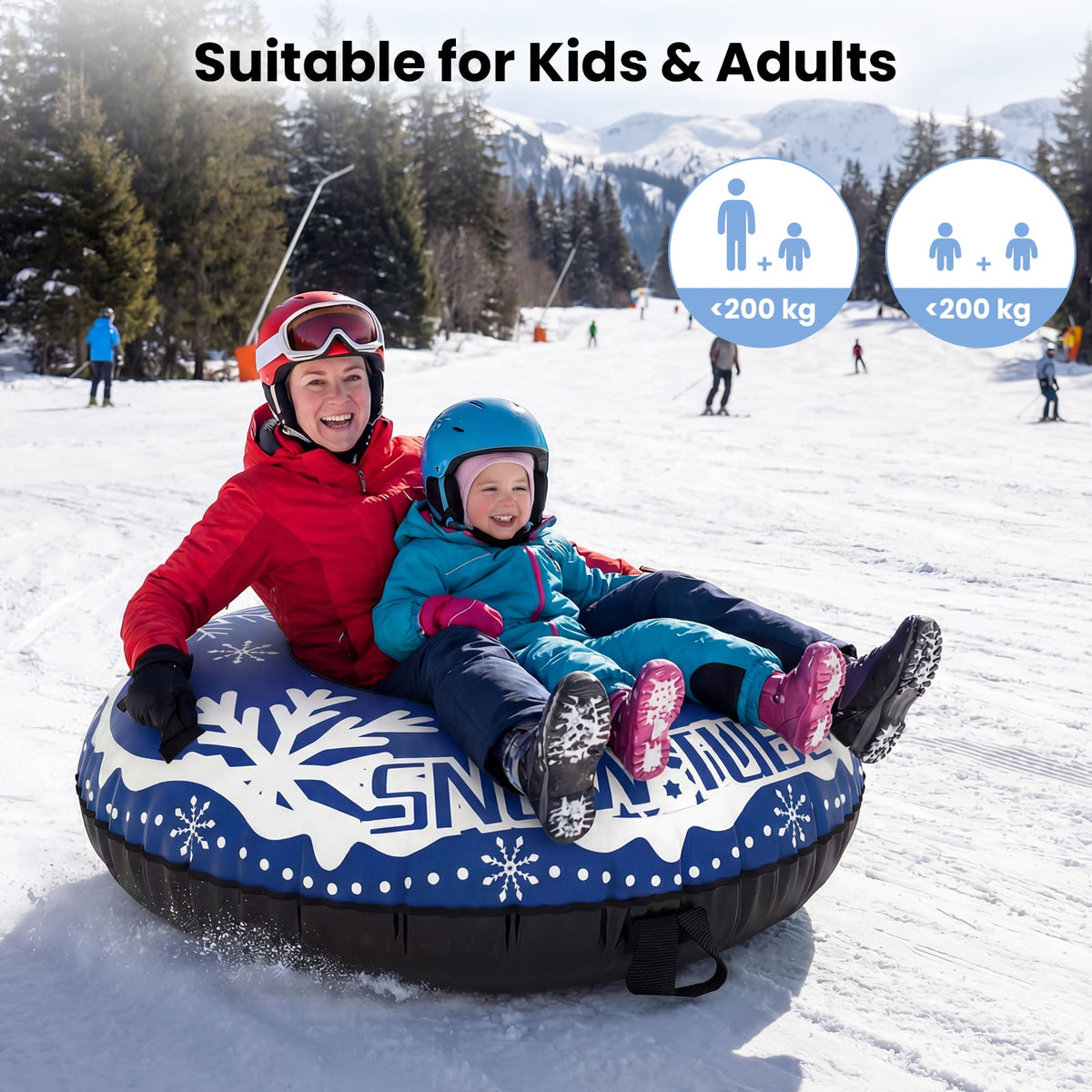 A mother and child enjoying a ride on the inflatable snow tube in the snow