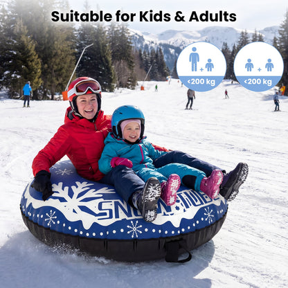 A mother and child enjoying a ride on the inflatable snow tube in the snow
