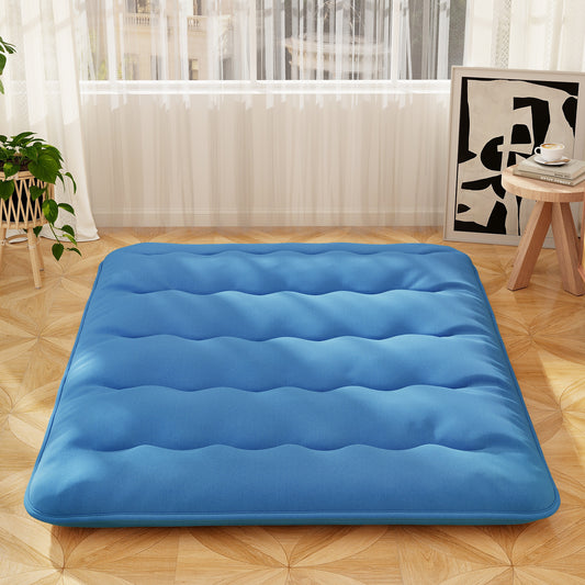 Blue Japanese floor mattress on a wooden floor in a bright room