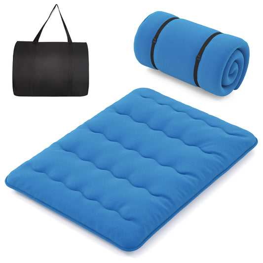Japanese Floor Mattress laid out flat with a rolled up mattress and a black carry bag nearby