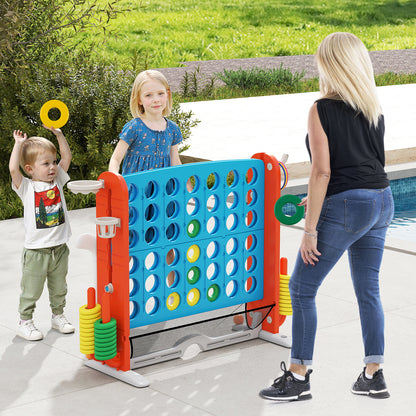 Family playing the lawn game outside by a swimming pool with rings