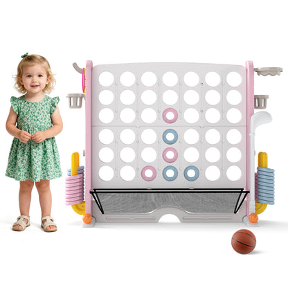A young girl standing next to the giant connect four game set with a basketball