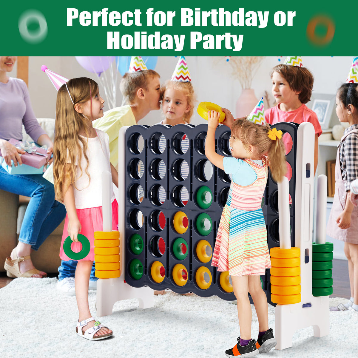 Children playing the giant four-in-a-row lawn game at a party