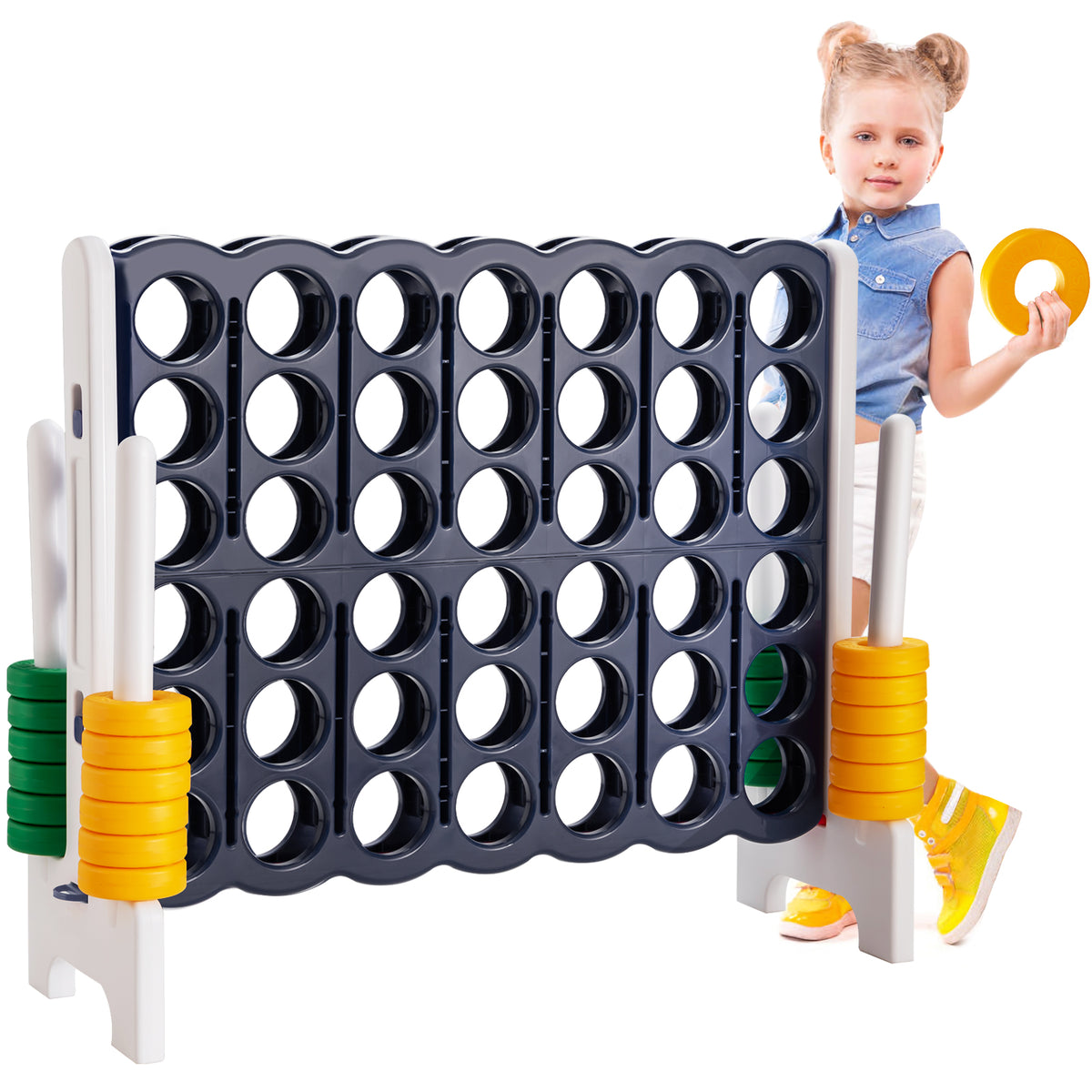 Girl holding rings next to the giant four-in-a-row lawn game