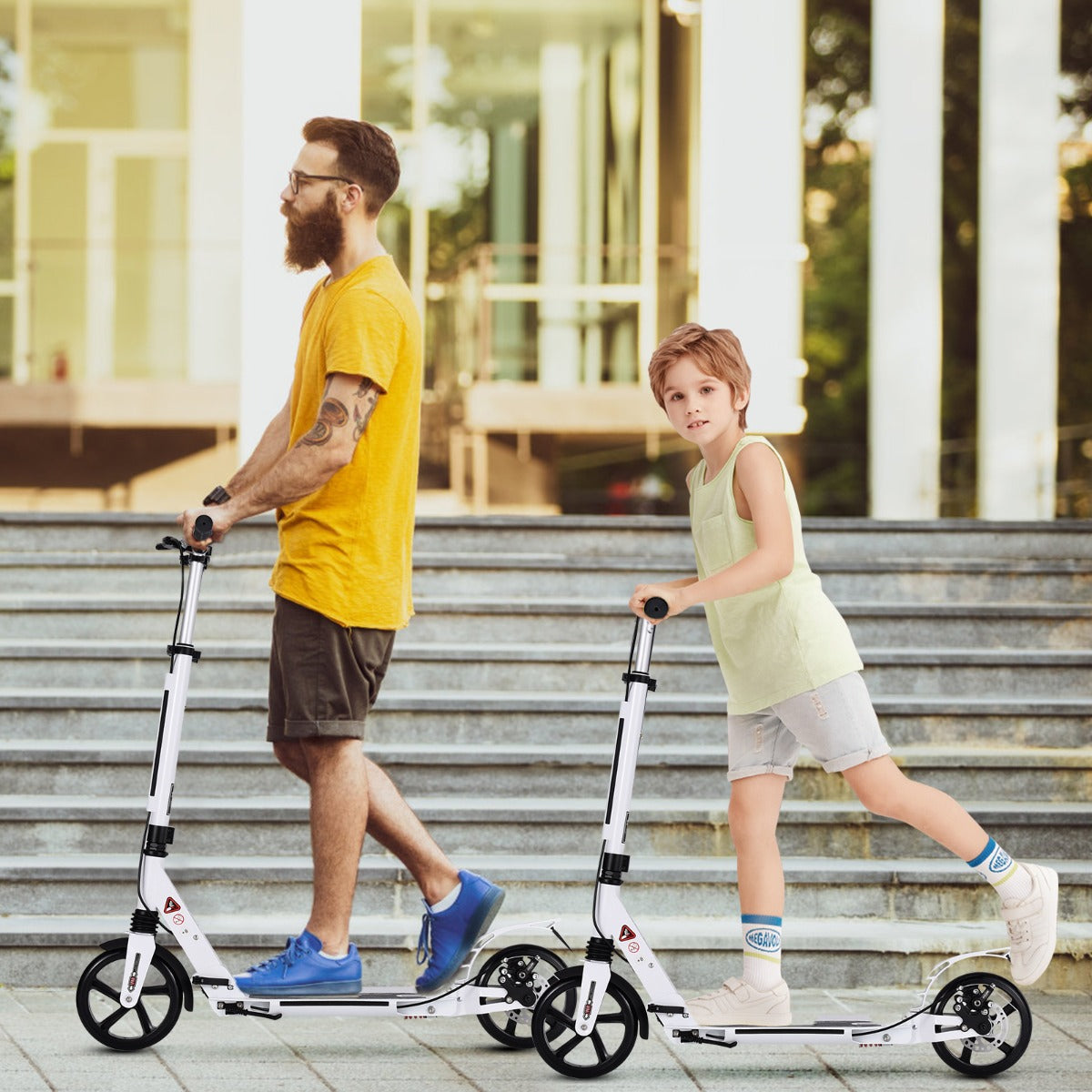A man and a boy ride white kick scooters with adjustable handlebars outdoors