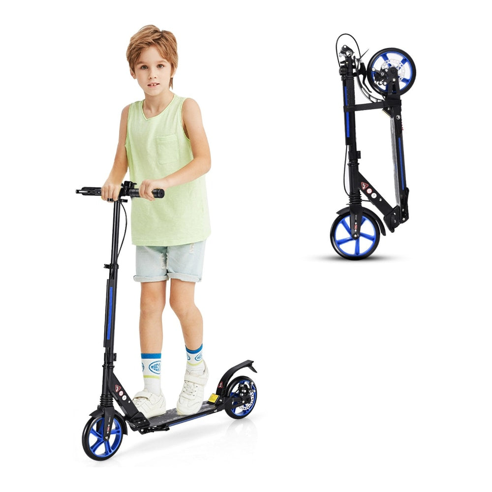 The kick scooter standing upright with a boy next to it, and a folded scooter in the background
