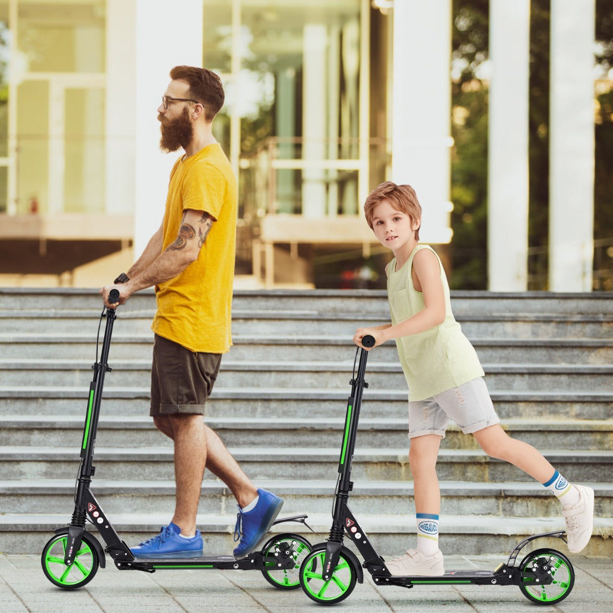 A father and son riding kick scooters side by side on outdoor stairs