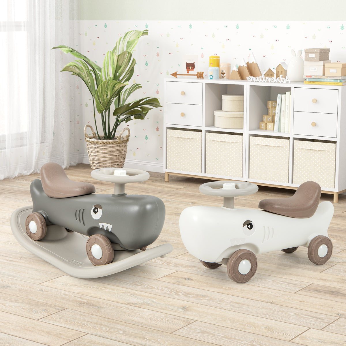 Two kids convertible rocking horse and sliding cars, one white and one grey, in a nursery room