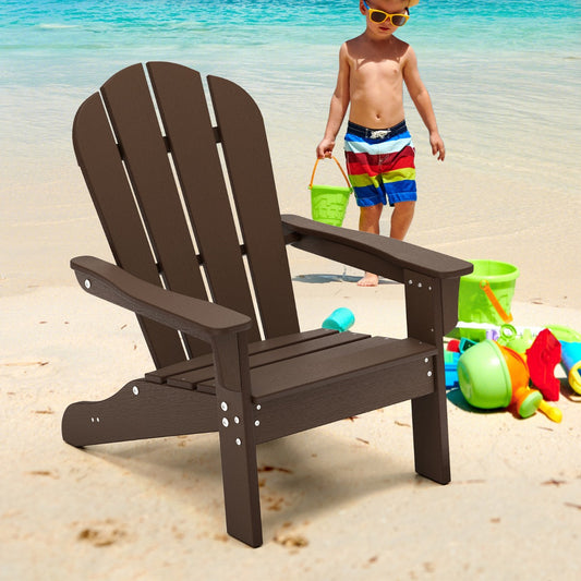 Brown kids Adirondack chair on a sandy beach with toys and a child in the background