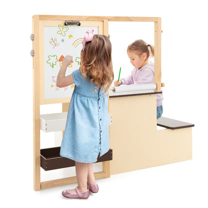 The kids table and chair set showing the whiteboard side being used by a young girl