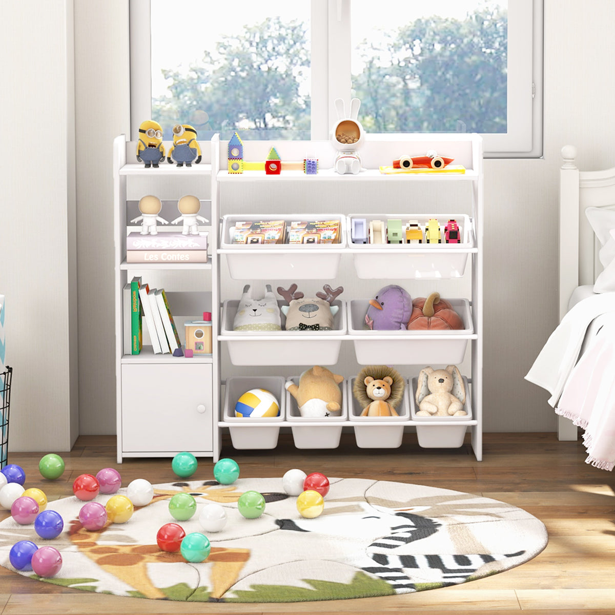 The white kids storage unit filled with toys and books in a nursery