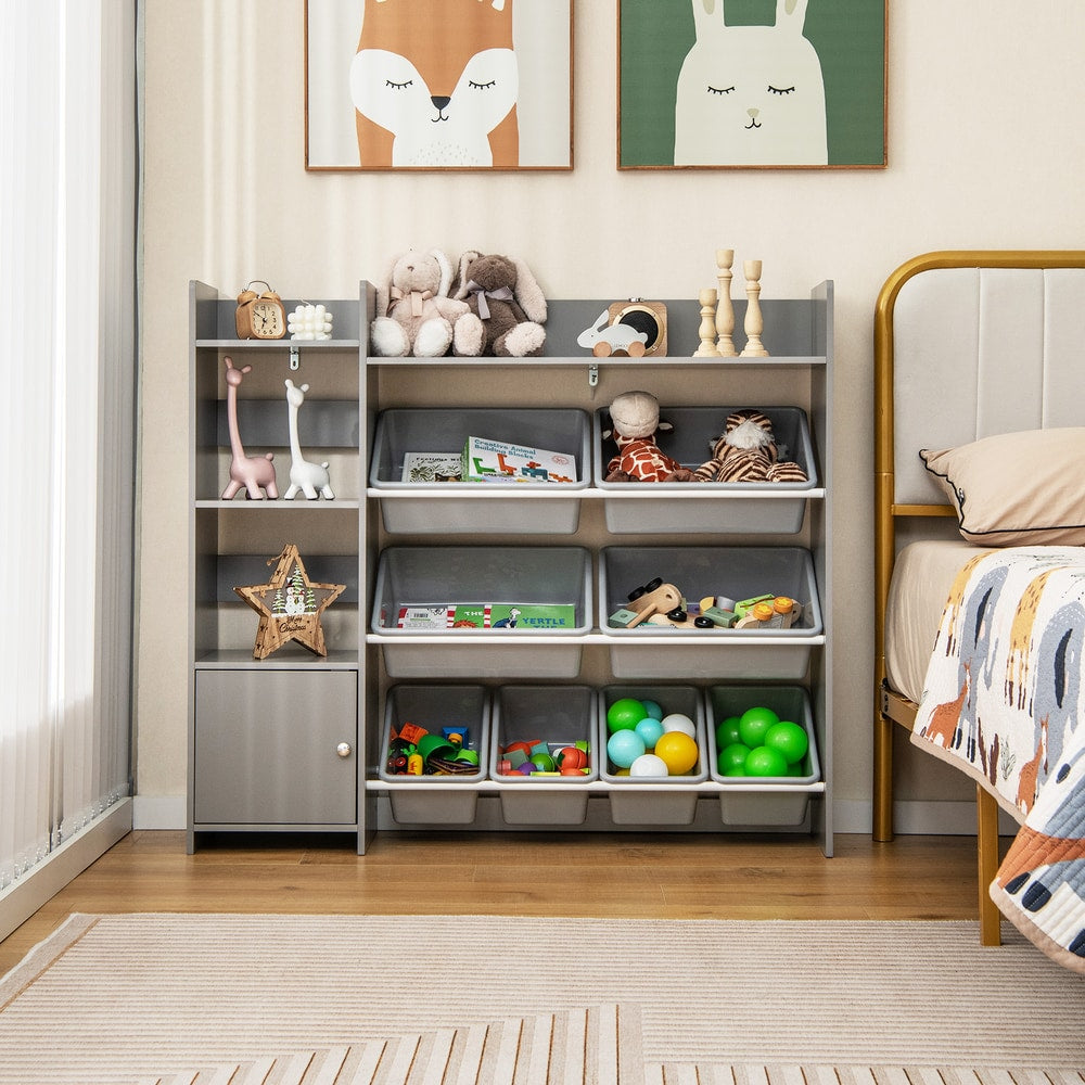 Grey toy storage unit with open shelves and storage boxes in a child's bedroom