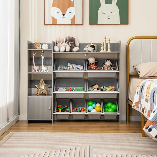 Grey toy storage unit with open shelves and storage boxes in a child's bedroom