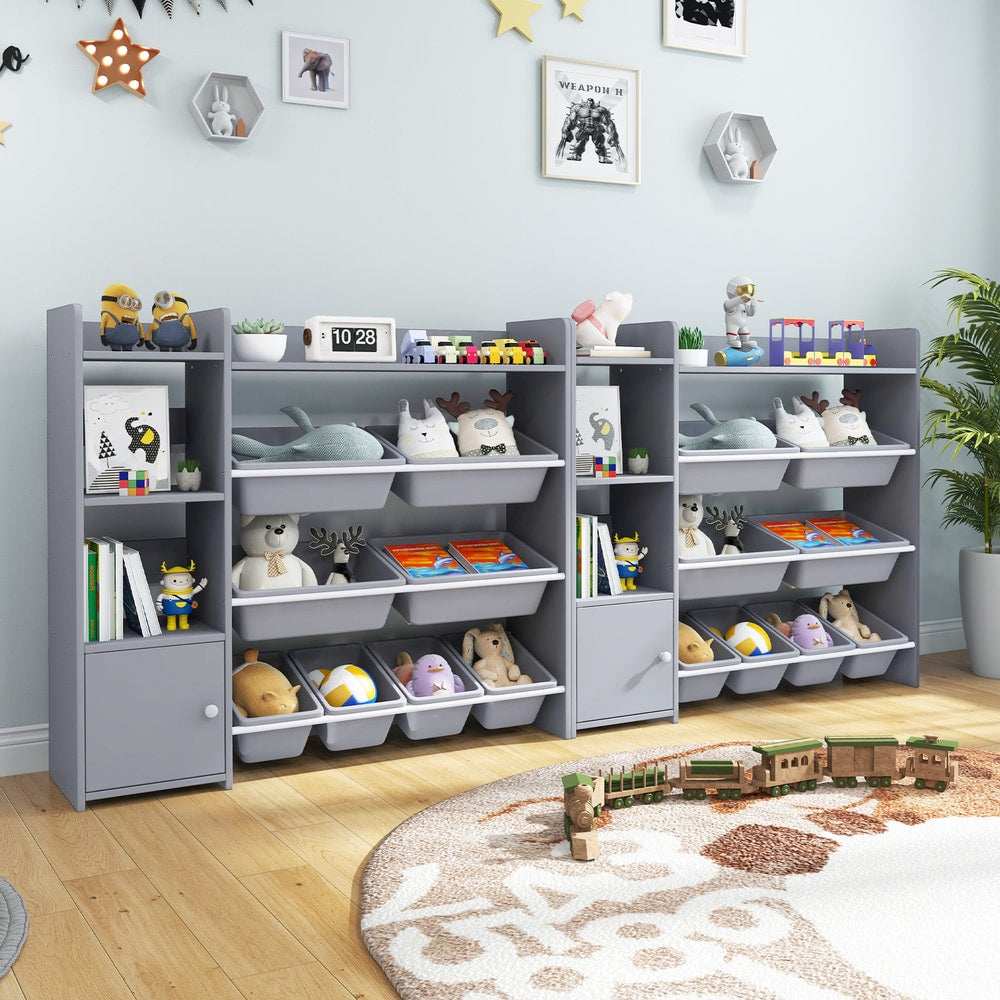 Three grey toy storage units arranged together in a playroom