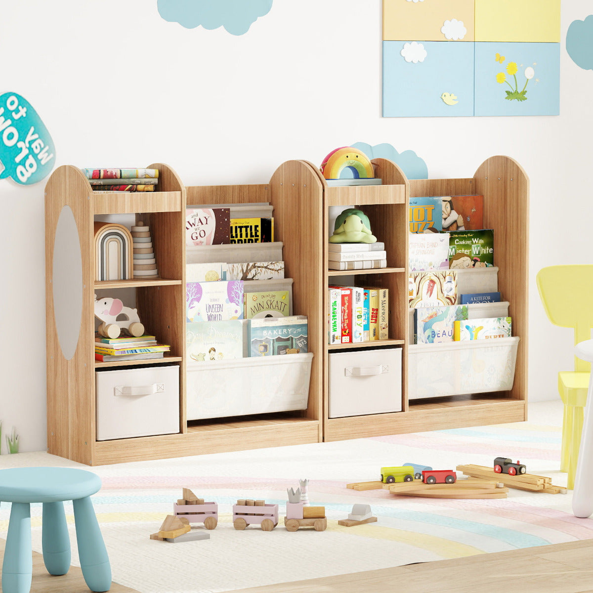 The kids bookshelf with mirror and sling shelves displays books and soft toys