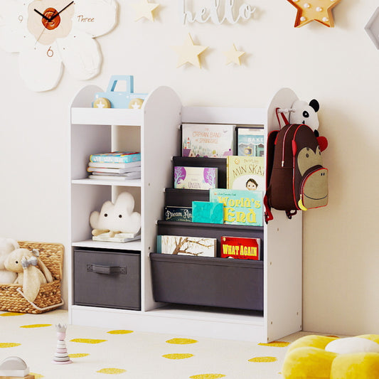 white kids storage unit featuring fabric sling shelves and side compartments filled with toys