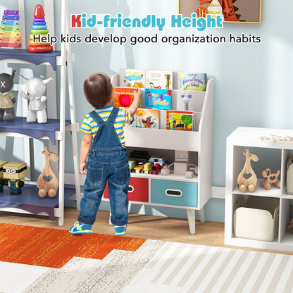 A child reaching for a book on the white kids storage unit in a bright room