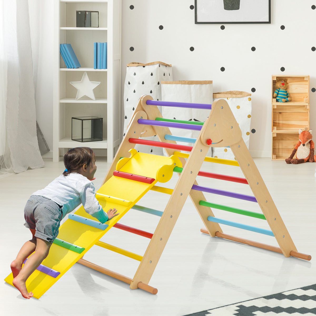 A child climbs up the side of the colourful wooden climbing frame