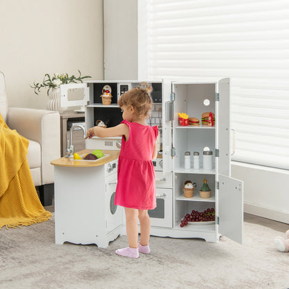 A young girl plays with the wooden play kitchen in a living room setting