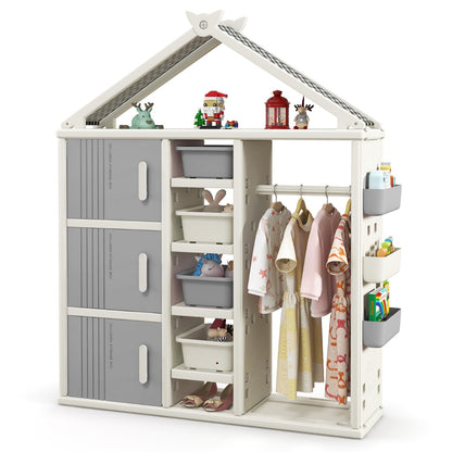 The kids storage closet is filled with clothes, shoes and storage bins