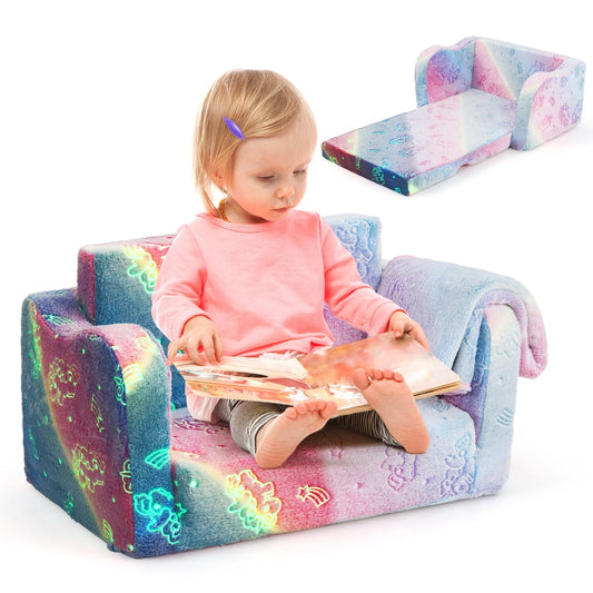 Kids Couch with Blanket 2-in-1 Folding Toddler Sofa Glow in the Dark Chair-Pink with a child reading