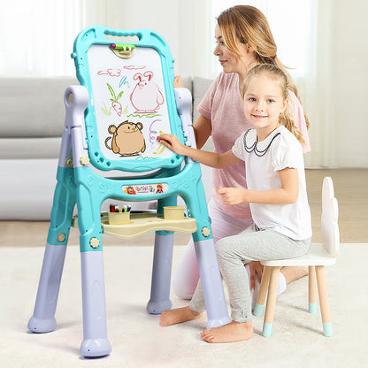 A mother and daughter drawing together on the green kids art easel in a living room