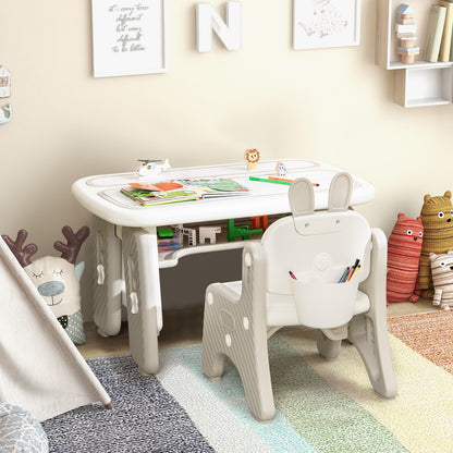 Grey kids table and chair set in a nursery room with toys and a tent