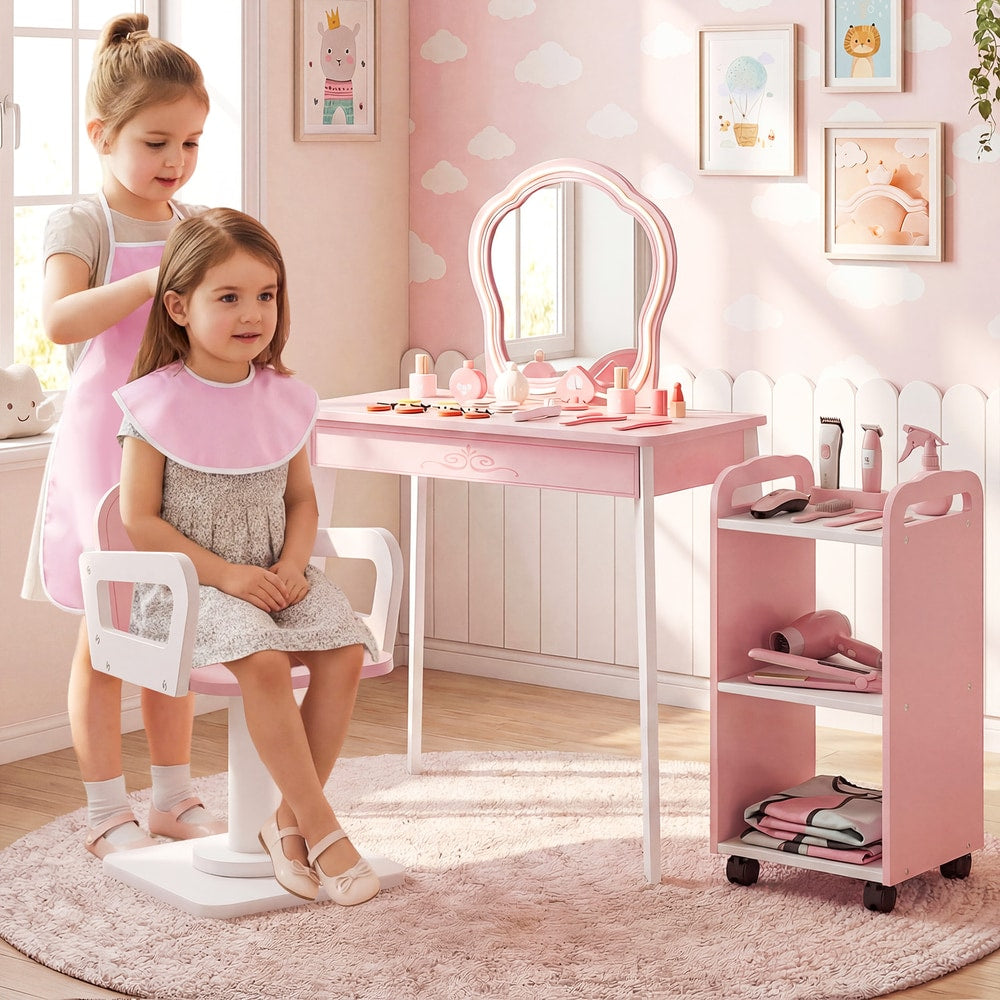 Two young girls playing with the pretend hair salon station in a child's bedroom