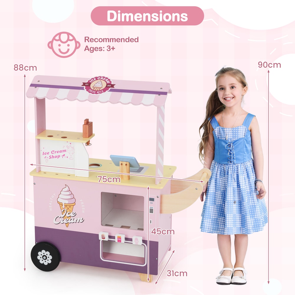 A girl and a boy stand next to the pink ice cream cart truck play kitchen set with dimensions shown