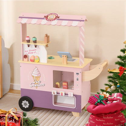 The pink ice cream cart truck play kitchen set displayed with festive decorations