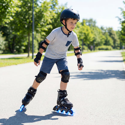 A boy wearing protective gear skates outdoors on grey adjustable roller skates