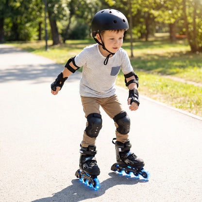 A young boy wearing the toy sports gear and safety pads while skating on a path