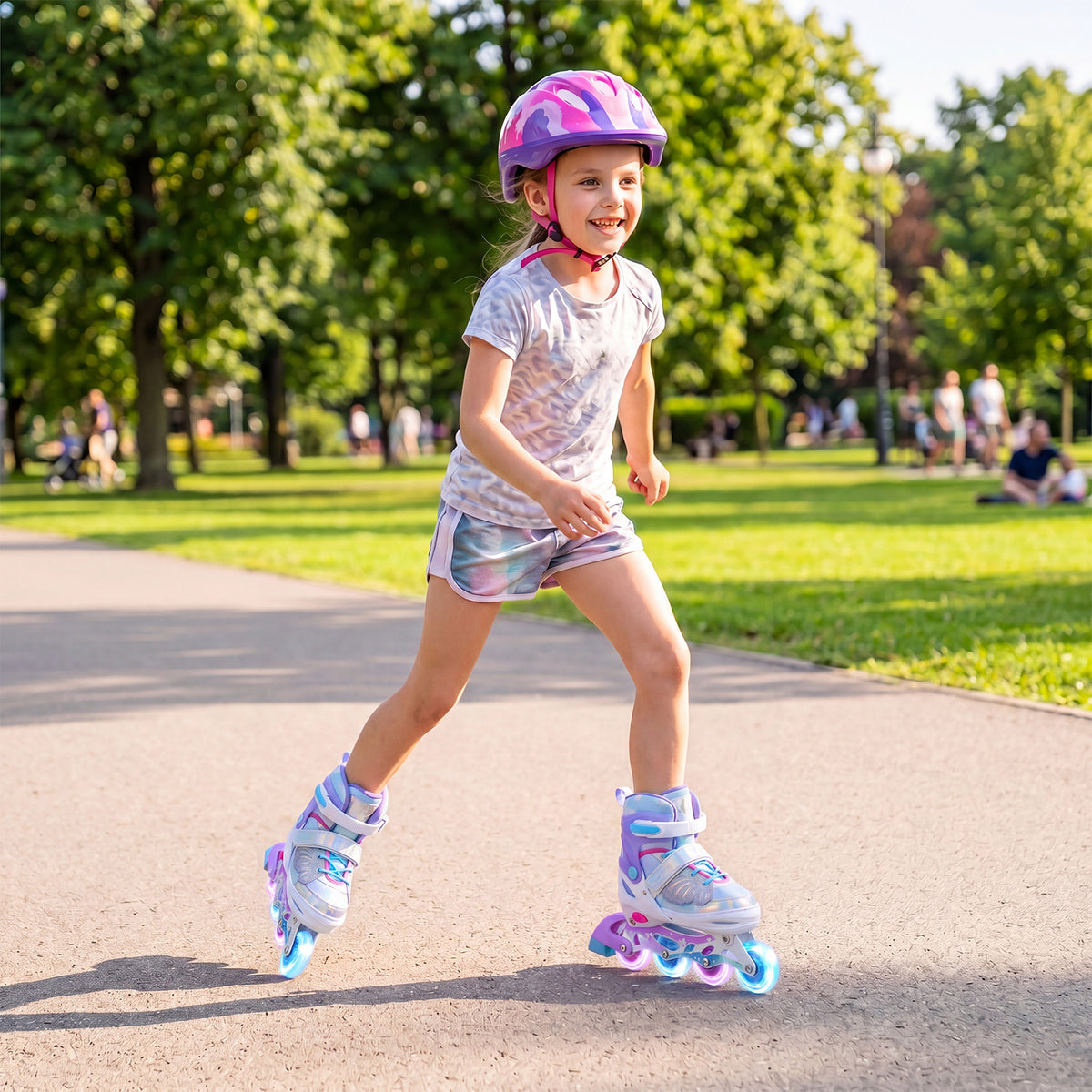 The toy sports skate being used by a young girl wearing a helmet and protective gear