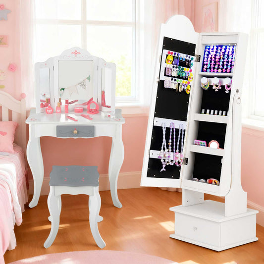 The kids vanity set placed next to the white jewellery storage cabinet in a bedroom