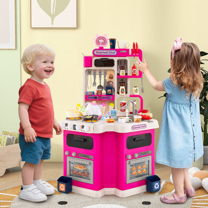 Two toddlers playing with the pink corner play kitchen set