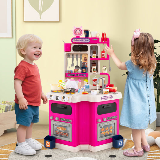 Two toddlers playing with the pink corner play kitchen set