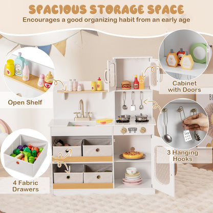 The white play kitchen showing storage features like fabric drawers and hanging hooks