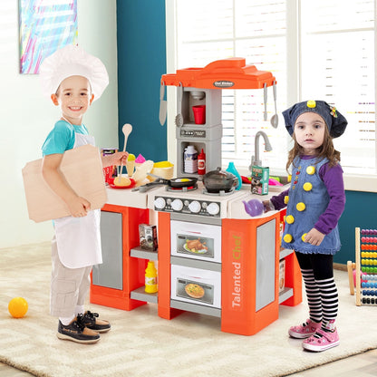 Two children playing with the orange play kitchen set with accessories