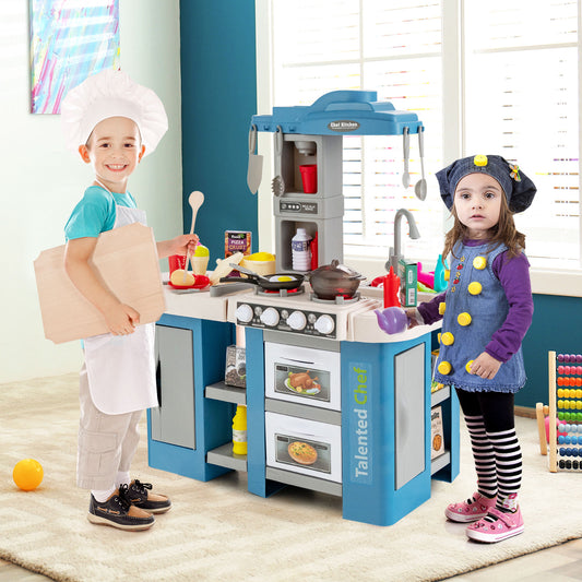 The play kitchen set being used by two children dressed as chefs in a bright room