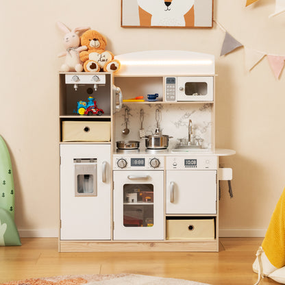 The play kitchen set is shown in a child's bedroom with toys and a blanket