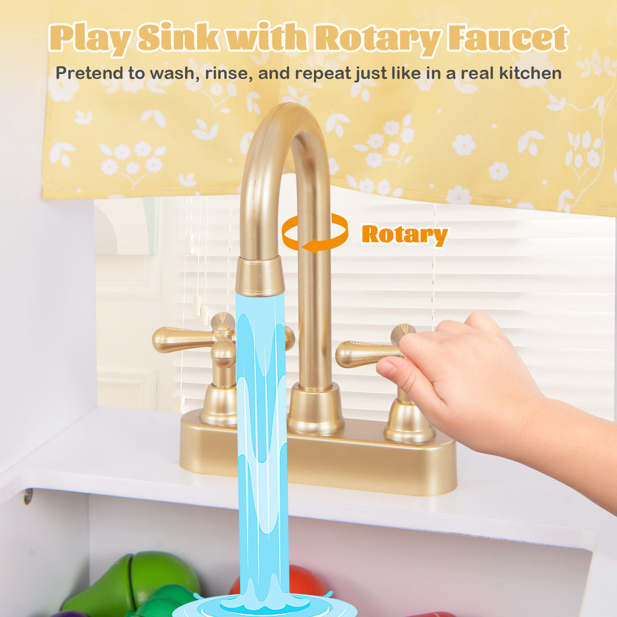 A child's hand turning the golden rotary faucet of the play kitchen set sink