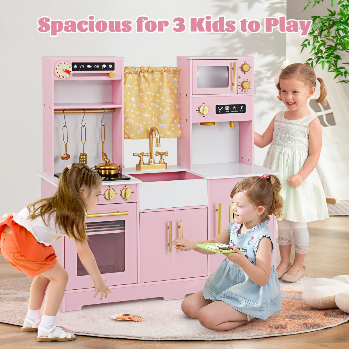 The play kitchen set being used by two young children playing together on a rug