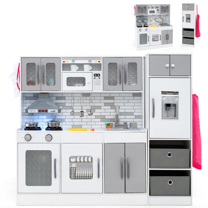 A grey and white toy kitchen with a child standing to the right, showing the full unit