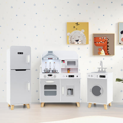 The grey play kitchen set with refrigerator and washing machine displayed in a room with wall art