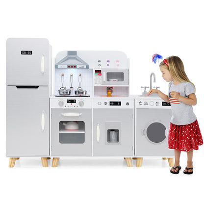 A young girl playing with the grey kitchen playset, interacting with the washing machine