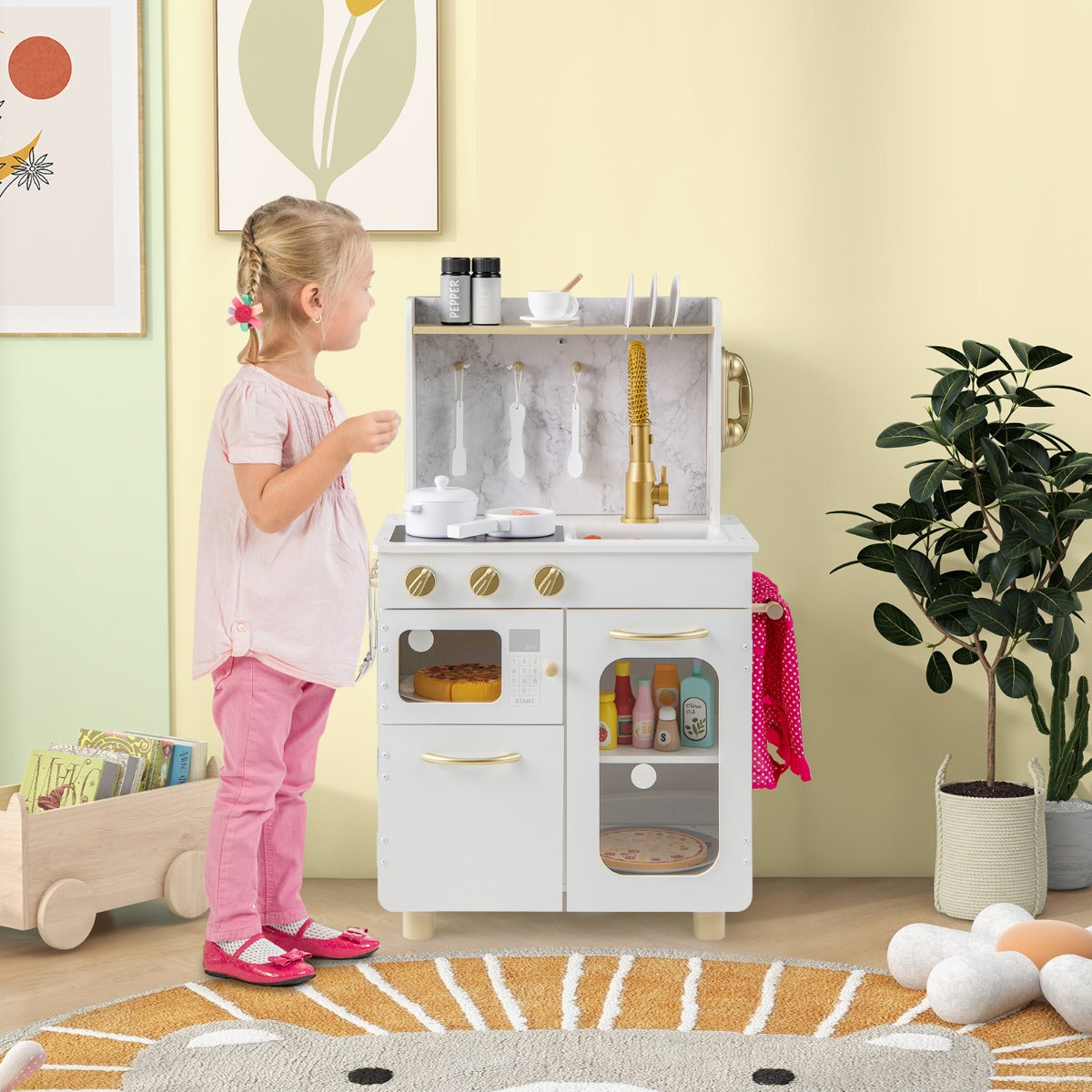 The play kitchen set standing in a bright nursery room next to a young girl playing