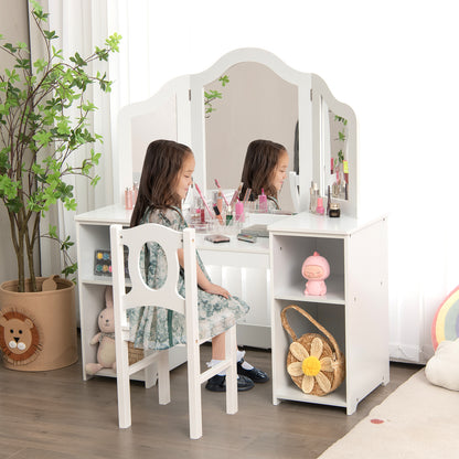 A young girl sits at the kids vanity table applying makeup